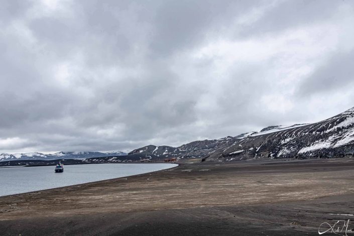 Scenic photo of deception island with ship