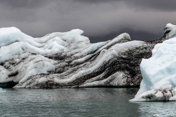 Best close-up photo of a iceberg, with blue and black layers