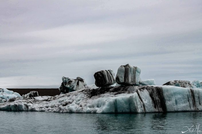 Best close-up photo of a iceberg, with blue and black layers