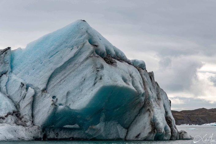 Best close-up photo of a iceberg, with blue and black layers