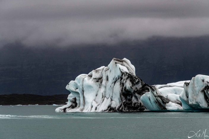 Best close-up photo of a iceberg, with blue and black layers