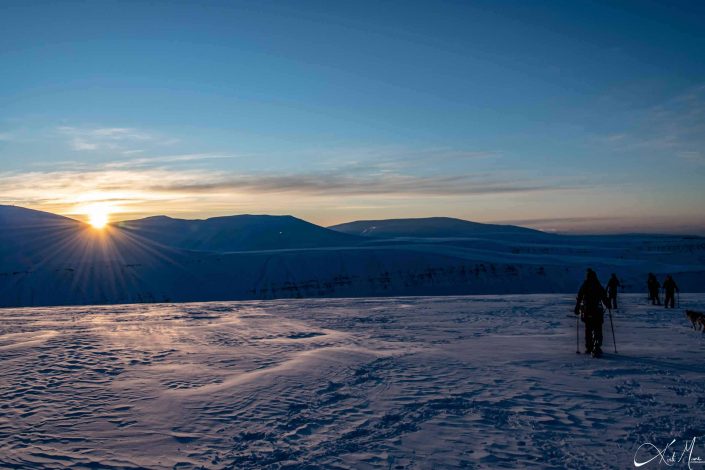 Best scenic sunset photo of snow covered mountains in Longyearbyen