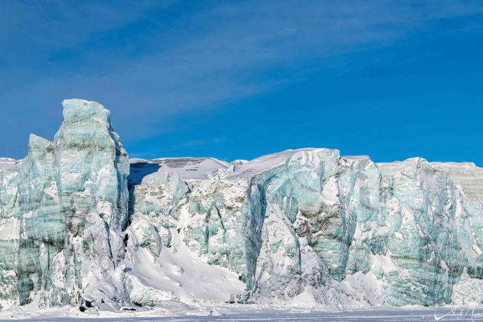 Close-up of glacier face by the frozen sea