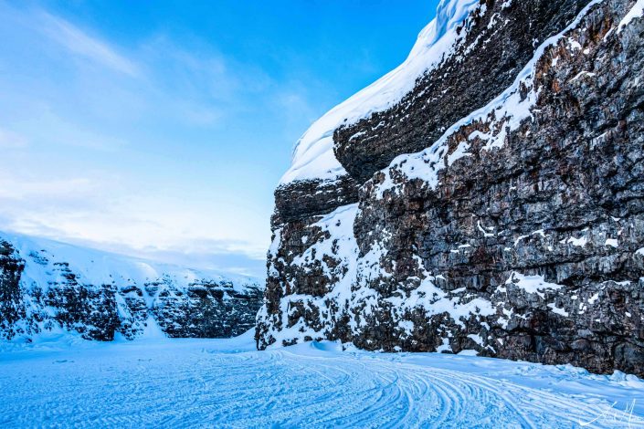 Scenic photo of a path in snow covered landscape