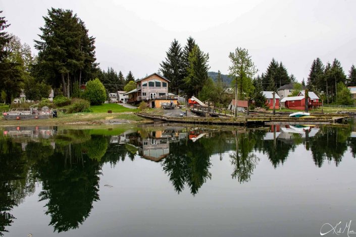 Beautiful reflection of houses and trees in water