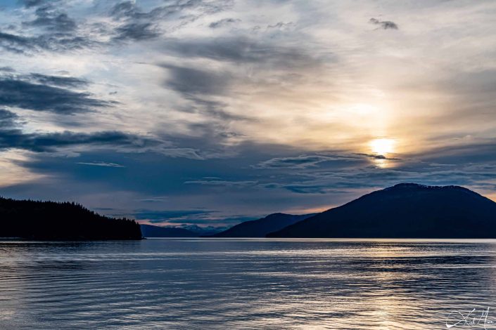 Scenic sunset with mountains and silvery water